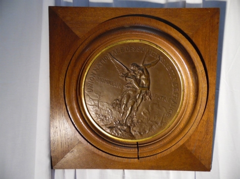 plaque bronze encadré 