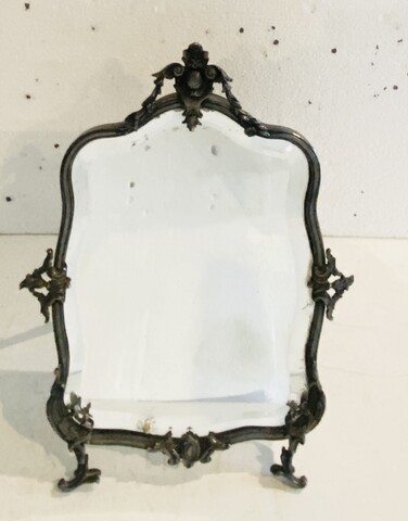 miroir de présentation en bronze argenté miroir biseauté . XX siècle.