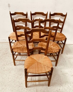 suite de six chaises assises paille en bois teinté merisier . XX siècle .